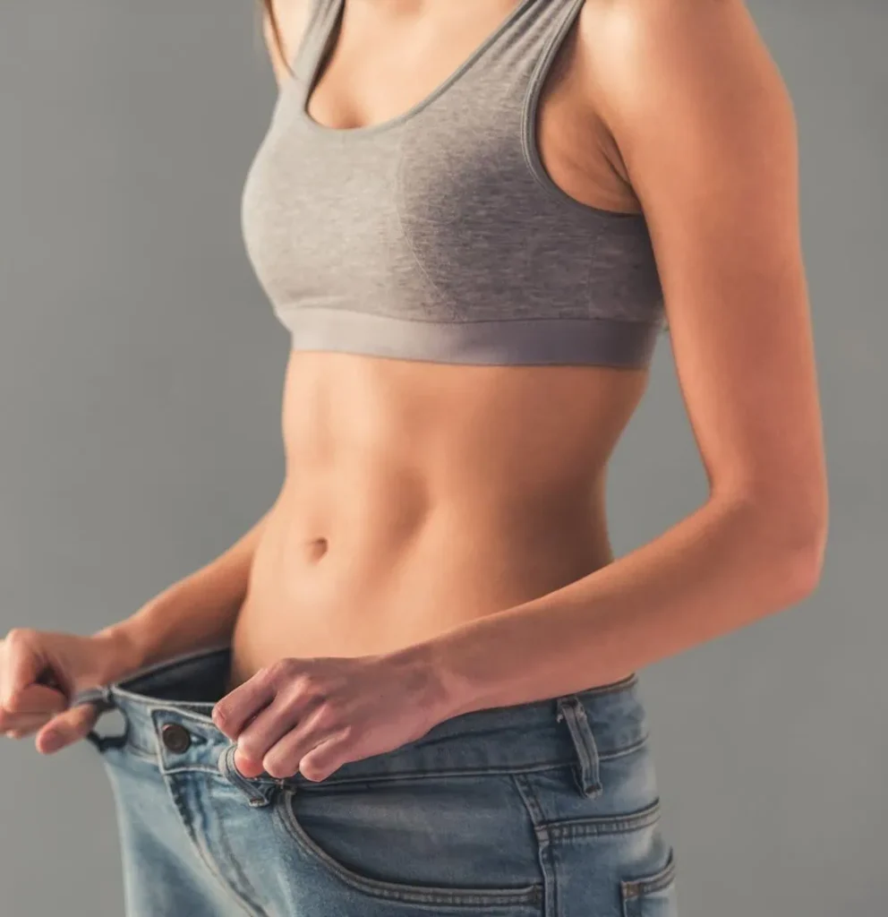 A woman in Bellmore shows off her weight loss by fitting into oversized jeans.