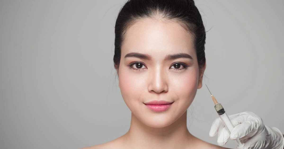 at MICARI Aesthetics & Veins performing a Sculptra injection to restore cheek volume in Bellmore.